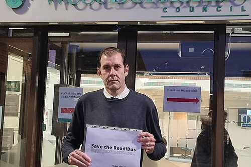 Cllr Lee Dillon with the ReadiBus petition outside West Berkshire Council offices